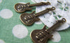 Accessories - 10 Pcs Of Antique Bronze Guitar Charms 11x35mm A1319