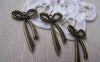 Accessories - 10 Pcs Of Antique Bronze Long Knot Bow Tie Charms 19x34mm A744