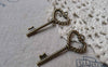 Accessories - 10 Pcs Of Antique Bronze Twisted Heart Screw Key Charms 17x36mm A6087