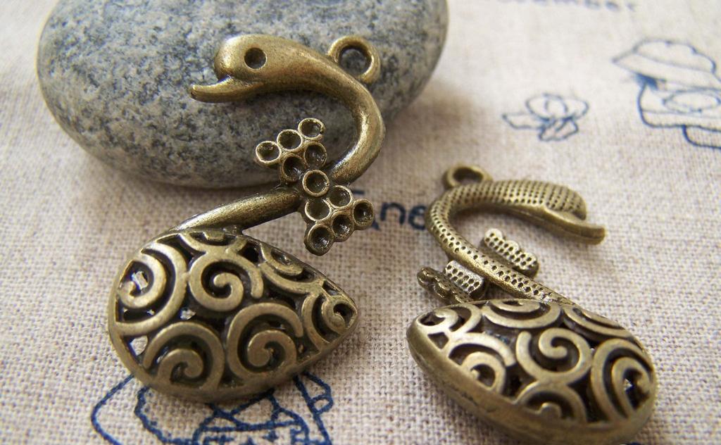 Accessories - 4 Pcs Of Antique Bronze 3 Dimensional Bow Tie Swan Charms Pendants 20x35mm A1794