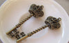 Accessories - 4 Pcs Of Antique Bronze Twisted Crown Key Charms 20x61mm A5288