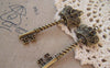 Accessories - 4 Pcs Of Antique Bronze Twisted Crown Key Charms 20x61mm A5288