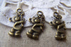 20 pcs Antique Bronze Cubs Bear Flower In Hand Charms A602