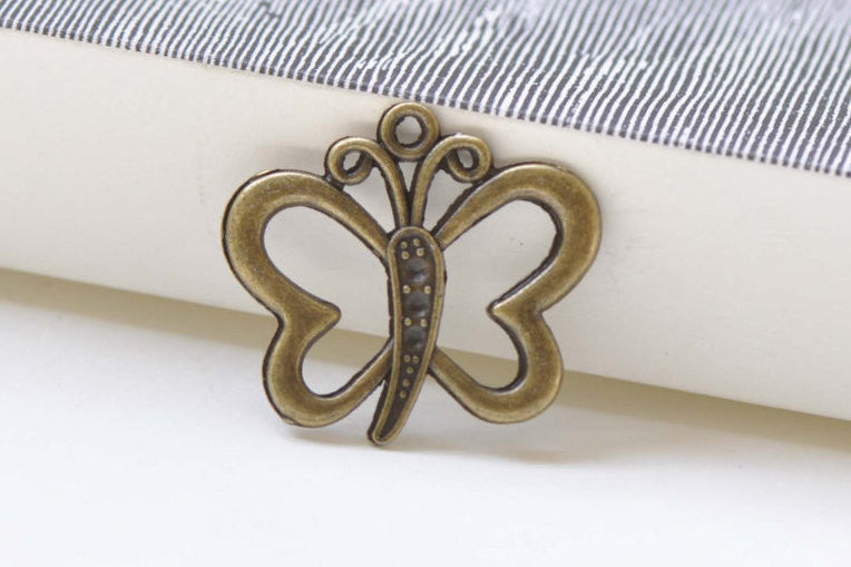 Outlined Small Butterfly Charms Antque Bronze Finish Set of 10 A8445