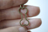 Antique Bronze Outlined Dog Bone Pet Ornament Charms Set of 20 A8013