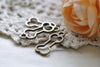 Antique Bronze Outlined Dog Bone Pet Ornament Charms Set of 20 A8013