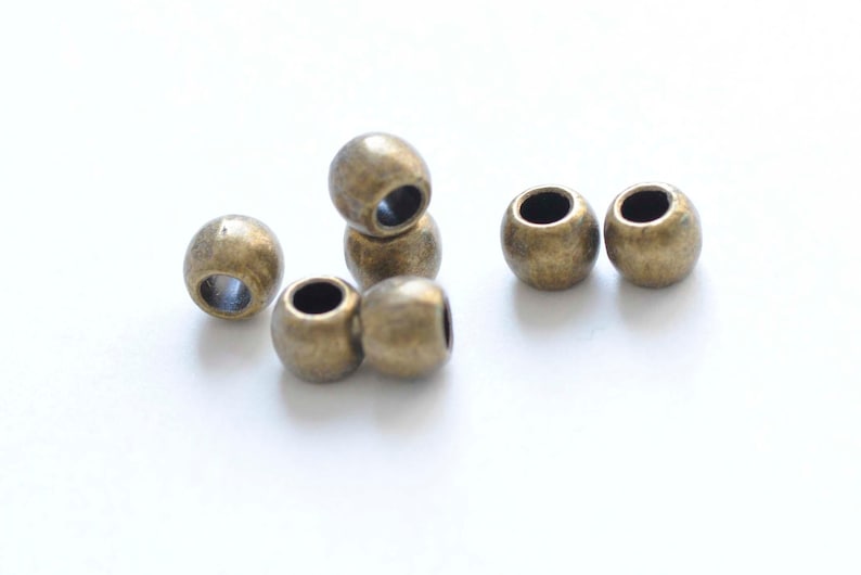 50 pcs of Antique Bronze Round Smooth Spacer Beads 6x7mm A6189