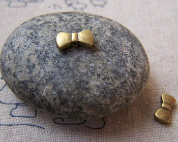 Accessories - 20 Pcs Of Antique Bronze Bowtie Knot Spacer Beads 5.5x10mm A5784