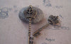 Accessories - 4 Pcs Of Antique Bronze Twisted Crown Key Charms 20x61mm A5288