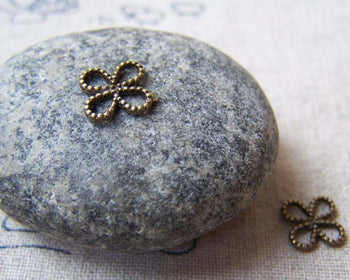Accessories - 50 Pcs Of Antique Bronze Tiny Coiled Chinese Knot Flower Charms 8mm A5652