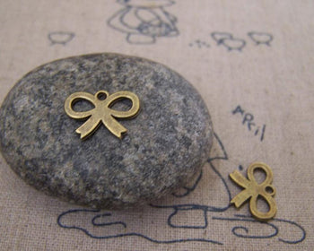 Accessories - 50 Pcs Of Antique Bronze Tiny Flat Butterfly Knot Bow Charms 10x14mm A5178