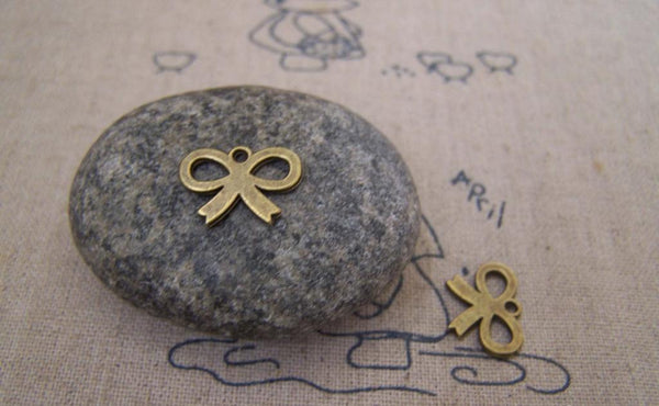 Accessories - 50 Pcs Of Antique Bronze Tiny Flat Butterfly Knot Bow Charms 10x14mm A5178