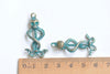 10 pcs of Antique Bronze/Silver/Green Patina Skull And Two Snakes Charms 15x37mm