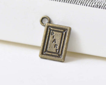 50 pcs Antique Bronze Diary Flat Charms 9x12mm A8473